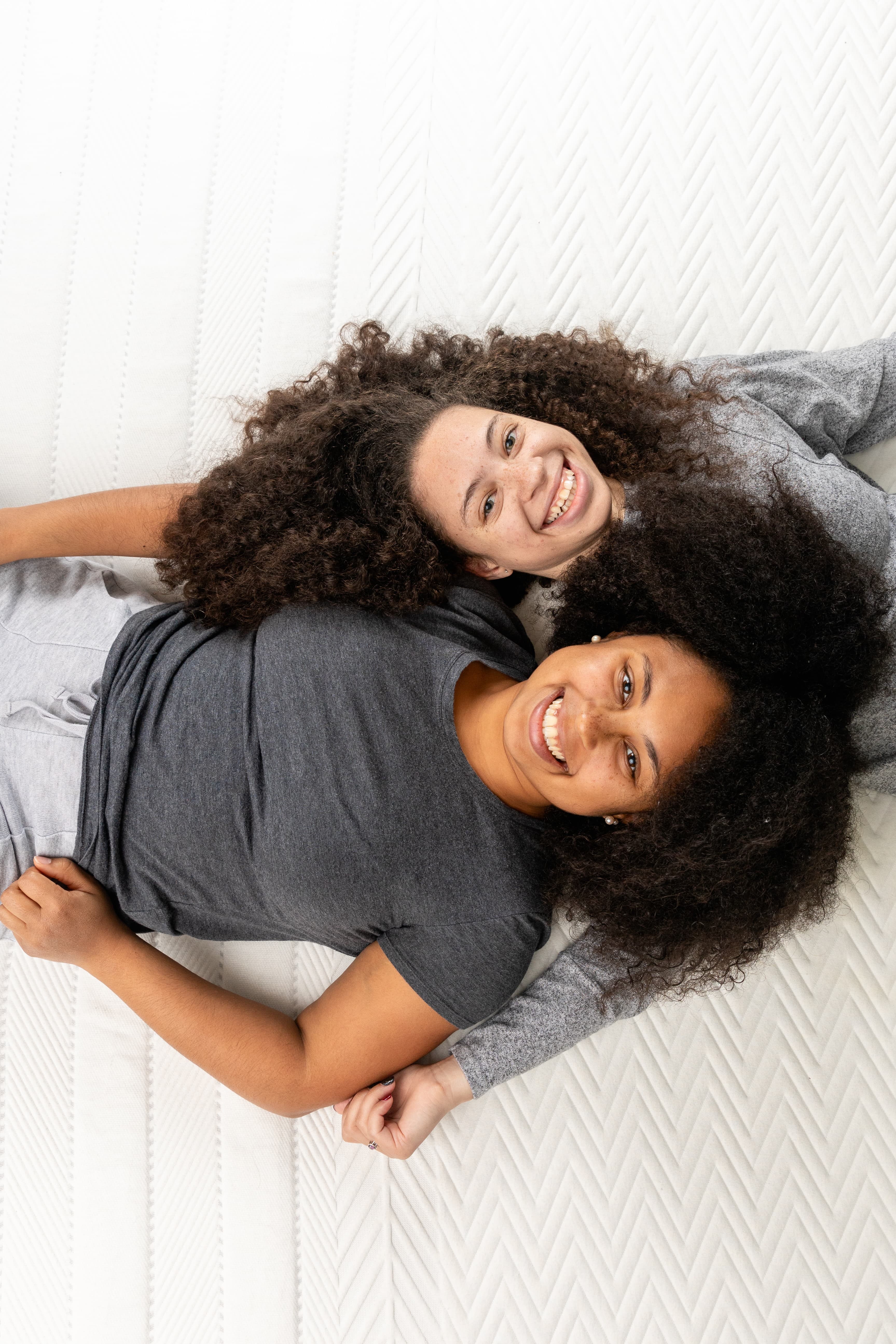 A mother and daughter lying on a Leesa mattress