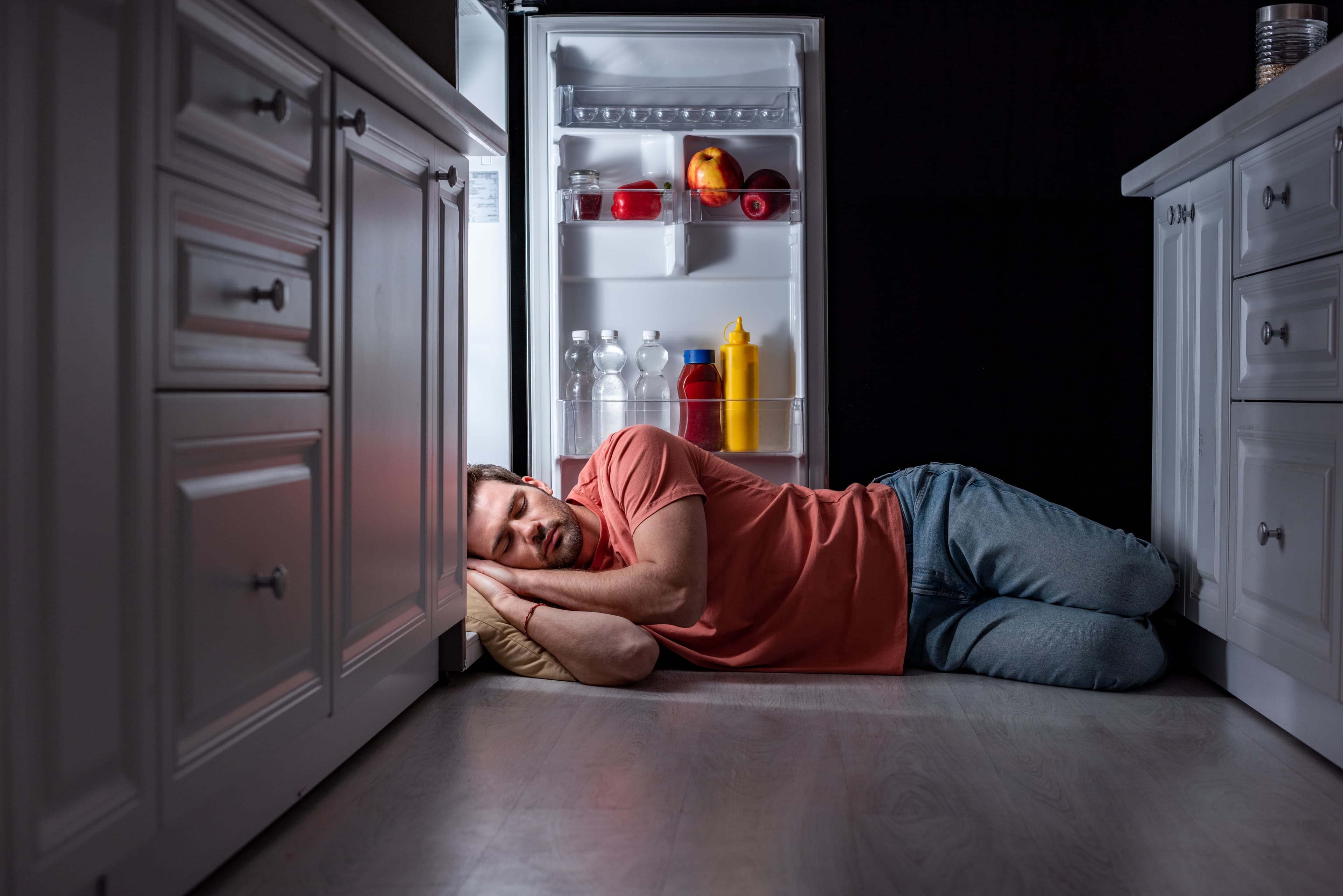 A man missing his Leesa mattress sleeping by the open fridge
